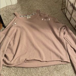 Pink sweater with shoulders cut out